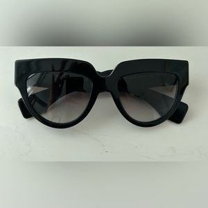 Prada Poeme black chunky sunglasses.